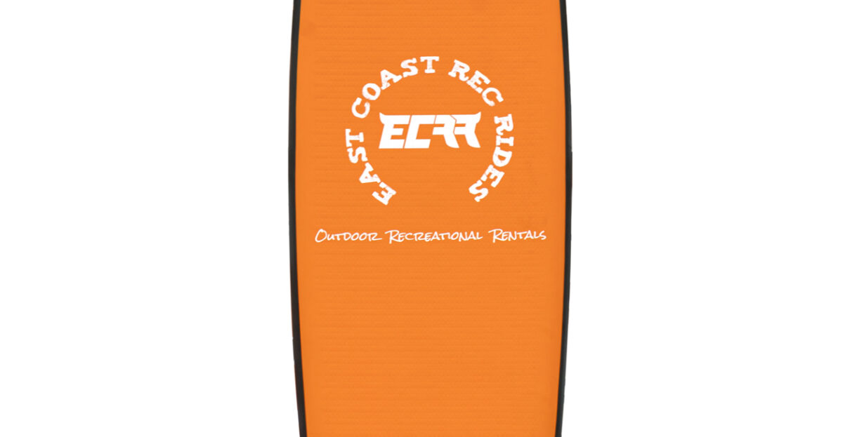 Stand-up paddleboarders exploring a calm lake on 11ft boards, surrounded by nature