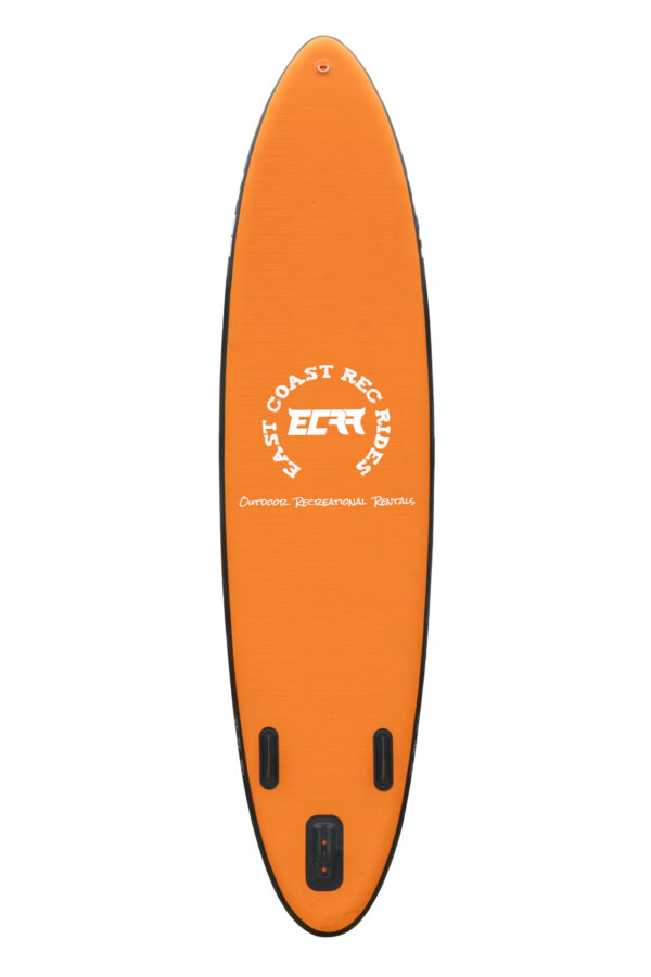Stand-up paddleboarders exploring a calm lake on 11ft boards, surrounded by nature
