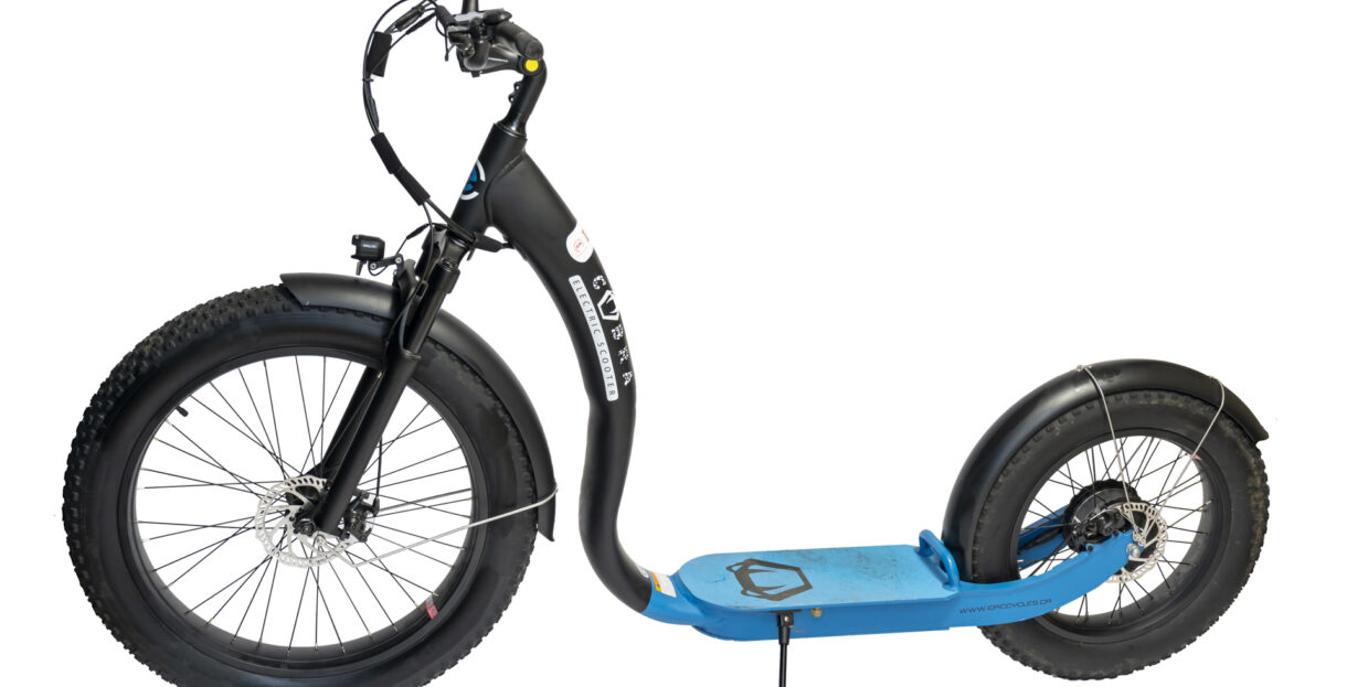 Detailed view of the sturdy frame and wide tires of a stylish fat-tire electric scooter